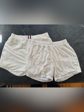 Pair of White Mesh Athletic Shorts with Red & Navy Waistband Detail